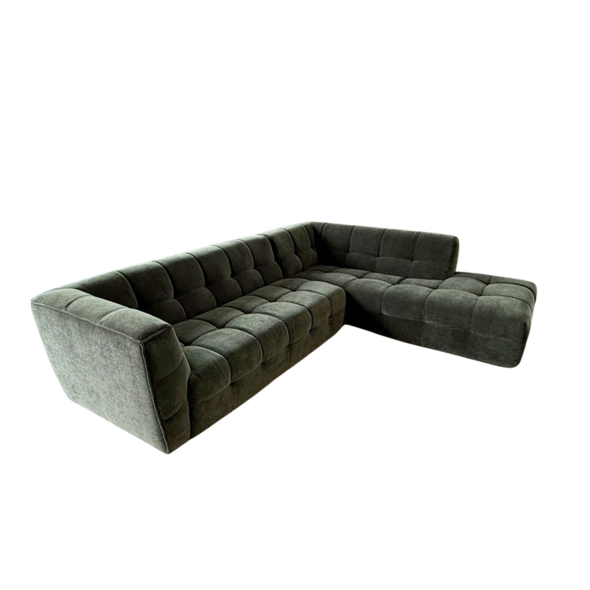 Green sectional sofa on a white background