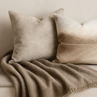 Beige taupe soft furnishings on a beige sofa