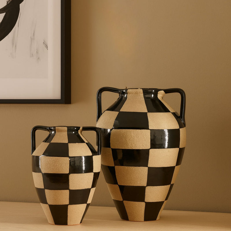 slinky style ornament placed on three books on a shelf