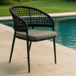 Outdoor dining chair next to a swimming pool