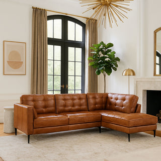 Leather chester style sofa with a chaise in a modern room with a big window