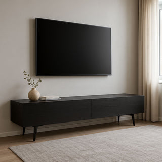 Tv against a wall with a black sleek entertainment unit