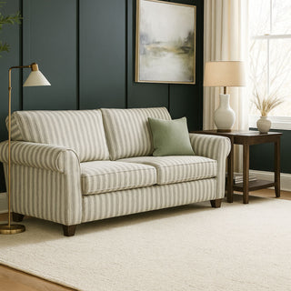 rolled arm sofa in a room with a dark teal wall