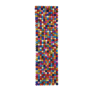 Bright multi-coloured felt ball table runner with a playful mix of colours