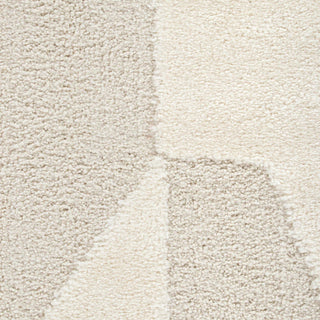 Close-up of a textured beige carpet with a subtle pattern
