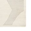Textured area rug with geometric pattern on a plain background