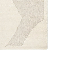Textured area rug with geometric pattern on a plain background