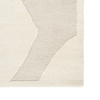 Textured area rug with geometric pattern on a plain background