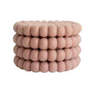 Blush pink felt ball coasters in 100% NZ wool – stylish, durable, and perfect for your table.