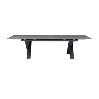 A modern rectangular dining table with a dark gray wood-grain top and black metal A-frame legs, shown against a plain white background.