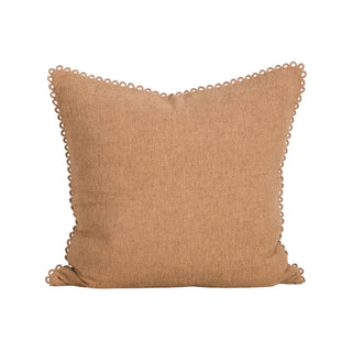 Clay coloured cushion with a loop edge design