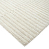 Close-up of a textured beige rug with a white background