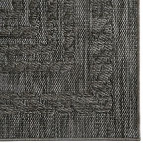Close-up of a textured gray rug corner