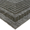 Close-up of a textured gray rug with a geometric pattern