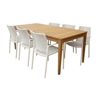 Wooden dining table with six white chairs on a white background