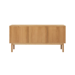 Wooden sideboard with three doors on a white background
