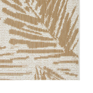 Textured beige and white patterned rug with palm leaf design
