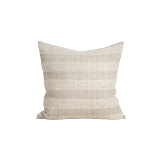 Beige textured pillow on a white background
