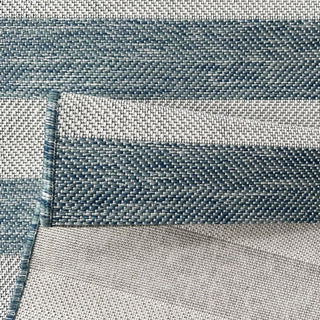 Close-up of blue and gray fabric with a textured pattern