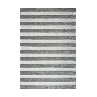 Striped rug with alternating dark and light stripes on a white background