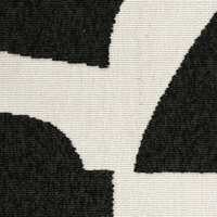 Close-up of a black and white geometric patterned rug.