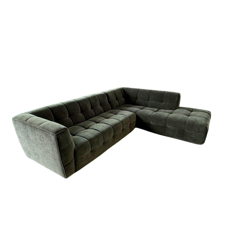 Green sectional sofa on a white background