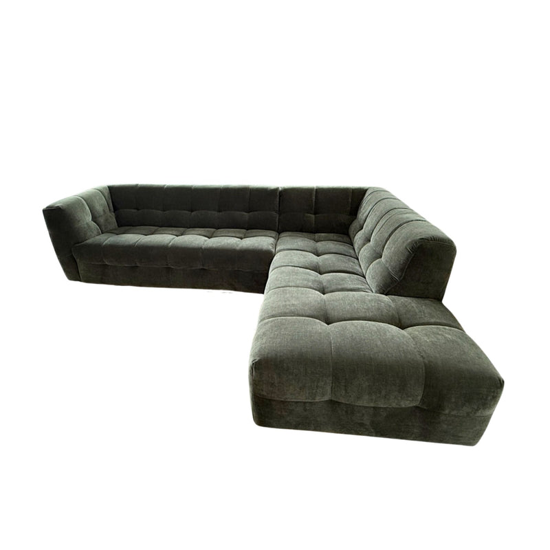 Green sectional sofa on a white background