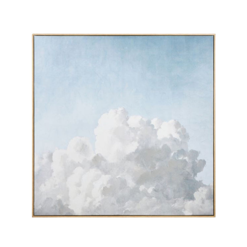 Framed artwork of a large cloud against a light blue sky