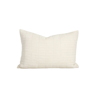 Beige pillow with a subtle pattern on a white background
