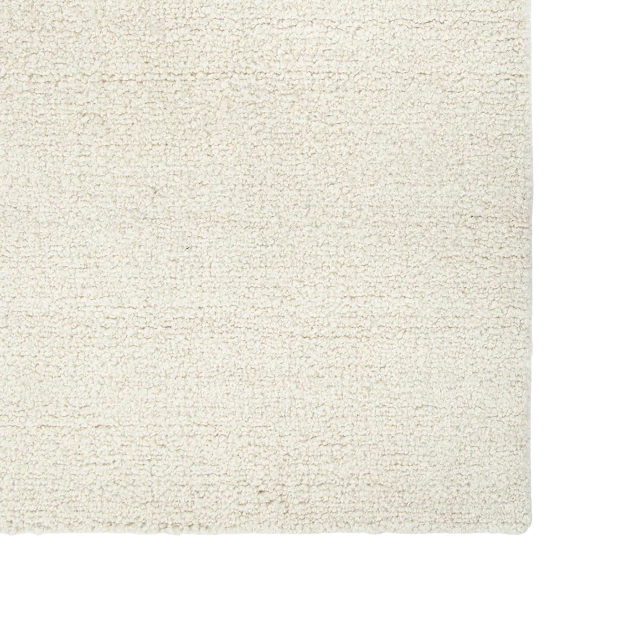 Close-up of a textured beige rug