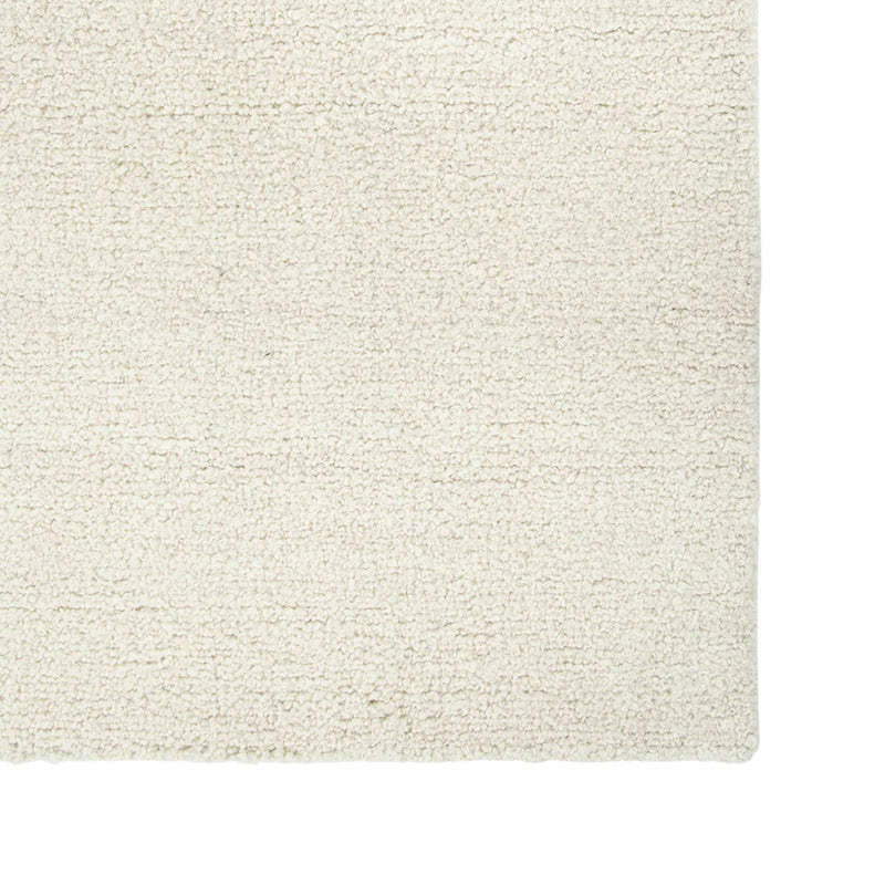 Close-up of a textured beige rug