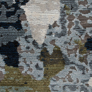 Close-up of a camouflage-patterned rug with various shades of brown, green, and gray.