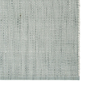 Textured green rug on a white background