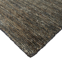 Textured brown and black rug on a white background