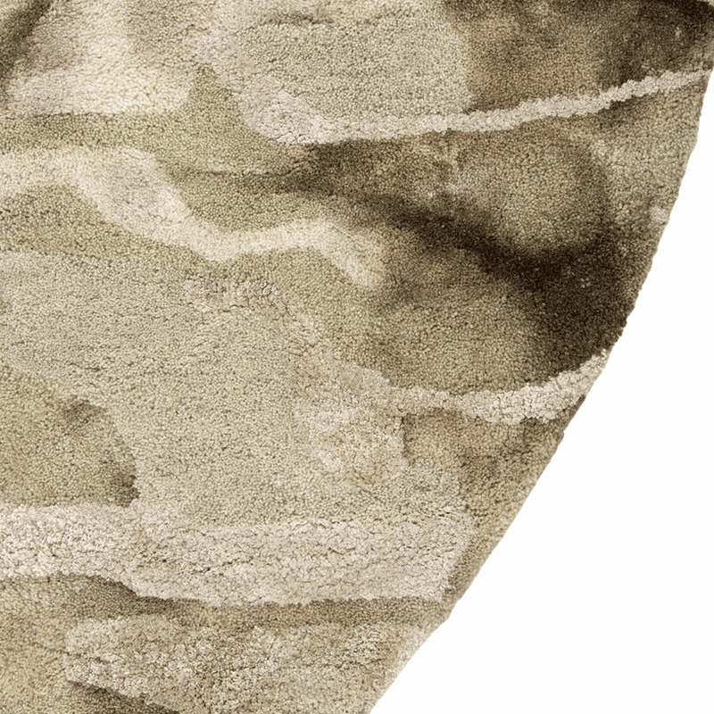 Close-up of a textured beige carpet corner