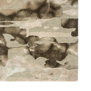 Close-up of a camouflage-patterned rug with brown, beige, and gray colors.