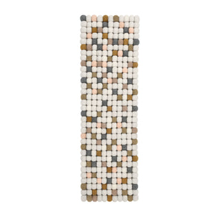Long rectangular felt ball table runner in neutral tones – cream, beige, and grey