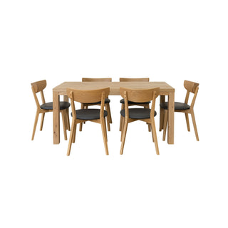 Wooden dining table with six matching chairs on a white background
