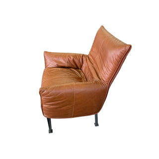 Brown leather armchair on a white background