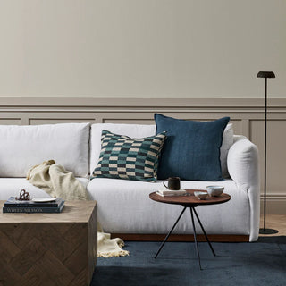 White sofa with decorative pillows in a living room setting