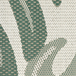 Close-up of a green and beige woven fabric pattern