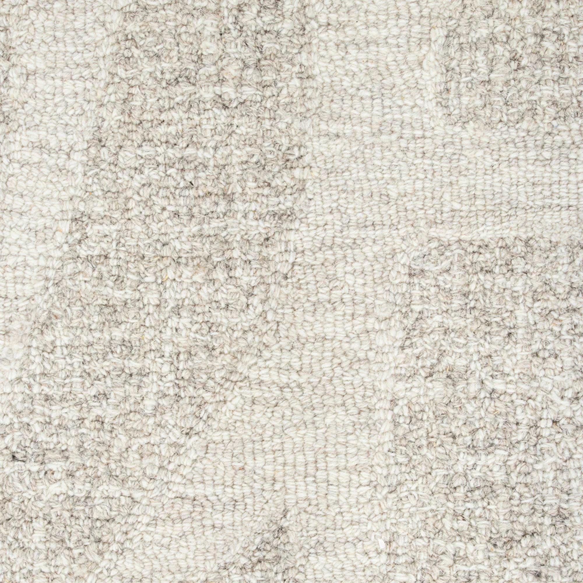 Close-up of a textured beige fabric surface