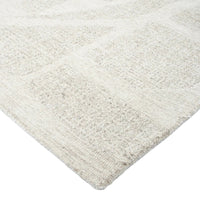 Close-up of a textured beige rug on a white background