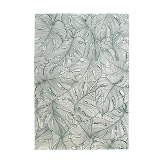 Pattern of stylized leaves on a white rug