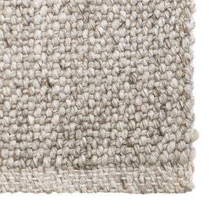 Close-up of a textured beige fabric sample