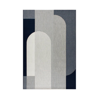 Geometric patterned rug with abstract shapes on a white background