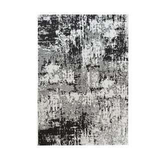 Abstract patterned rug with black, white, and gray colors on a white background