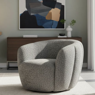 Gray textured armchair in a modern living room with abstract art on the wall.