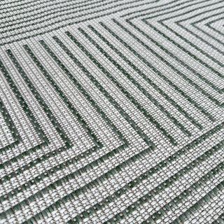 Close-up of a textured green and white patterned fabric