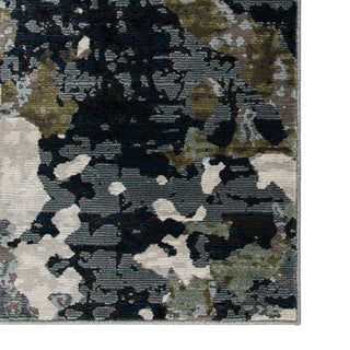 Multicolored abstract patterned rug with a mix of black, brown, beige, and gray.